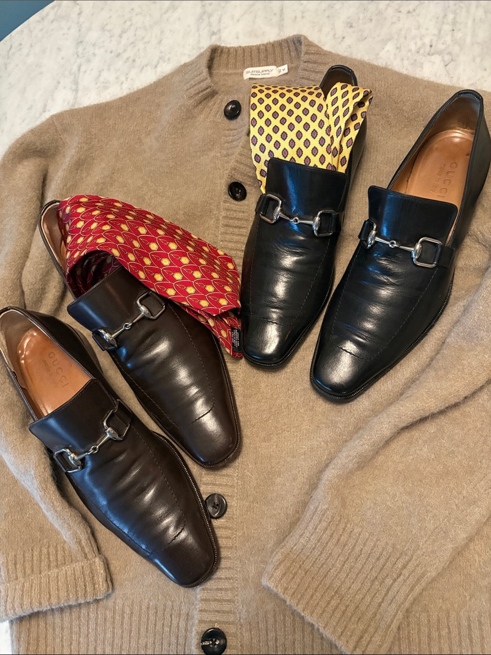 Gucci Men’s Black and Dark Brown Leather Horsebit Slip-Ons